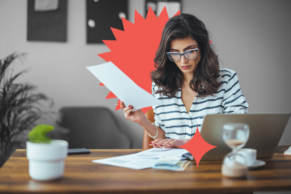 A smart business woman who keeps a paper account using a calculator, an old woman manages the account's finances, calculates the tax on the cash budget, plans to pay off a bank loan debt